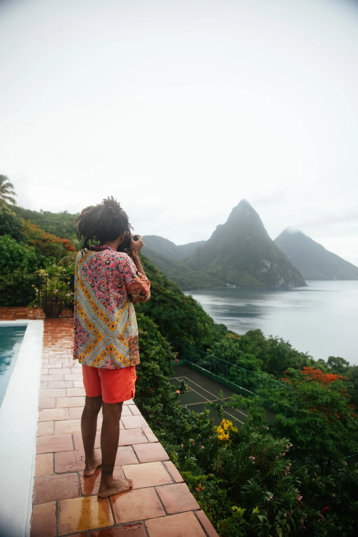 A local vendor standing by a road in lush St. Lucia